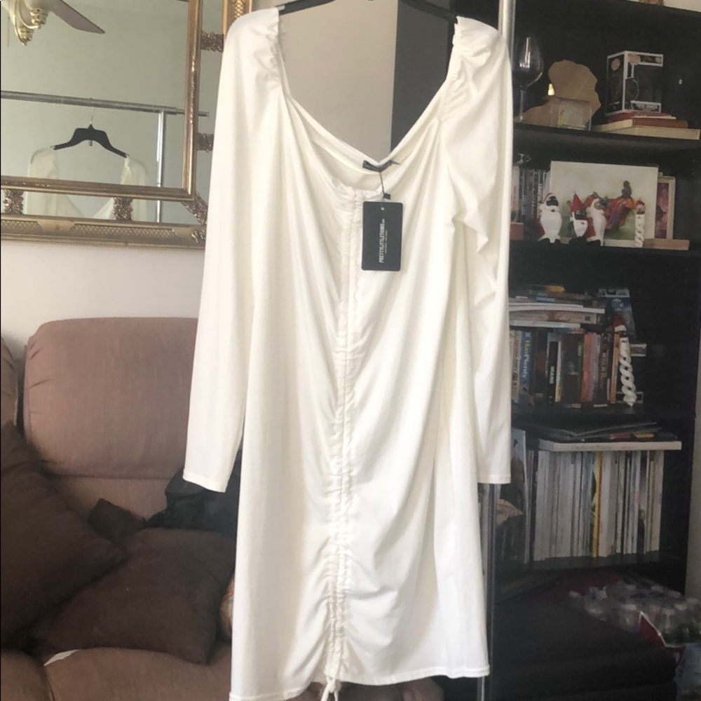 Long sleeved rushed front long body con dress.
